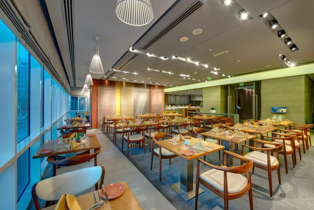 فندق إيه سي تي الشارقة المظهر الخارجي الصورة The restaurant