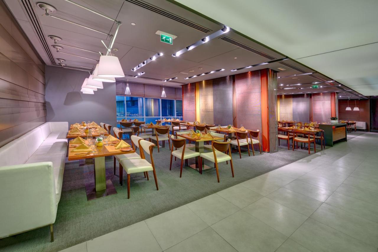 فندق إيه سي تي الشارقة المظهر الخارجي الصورة The restaurant