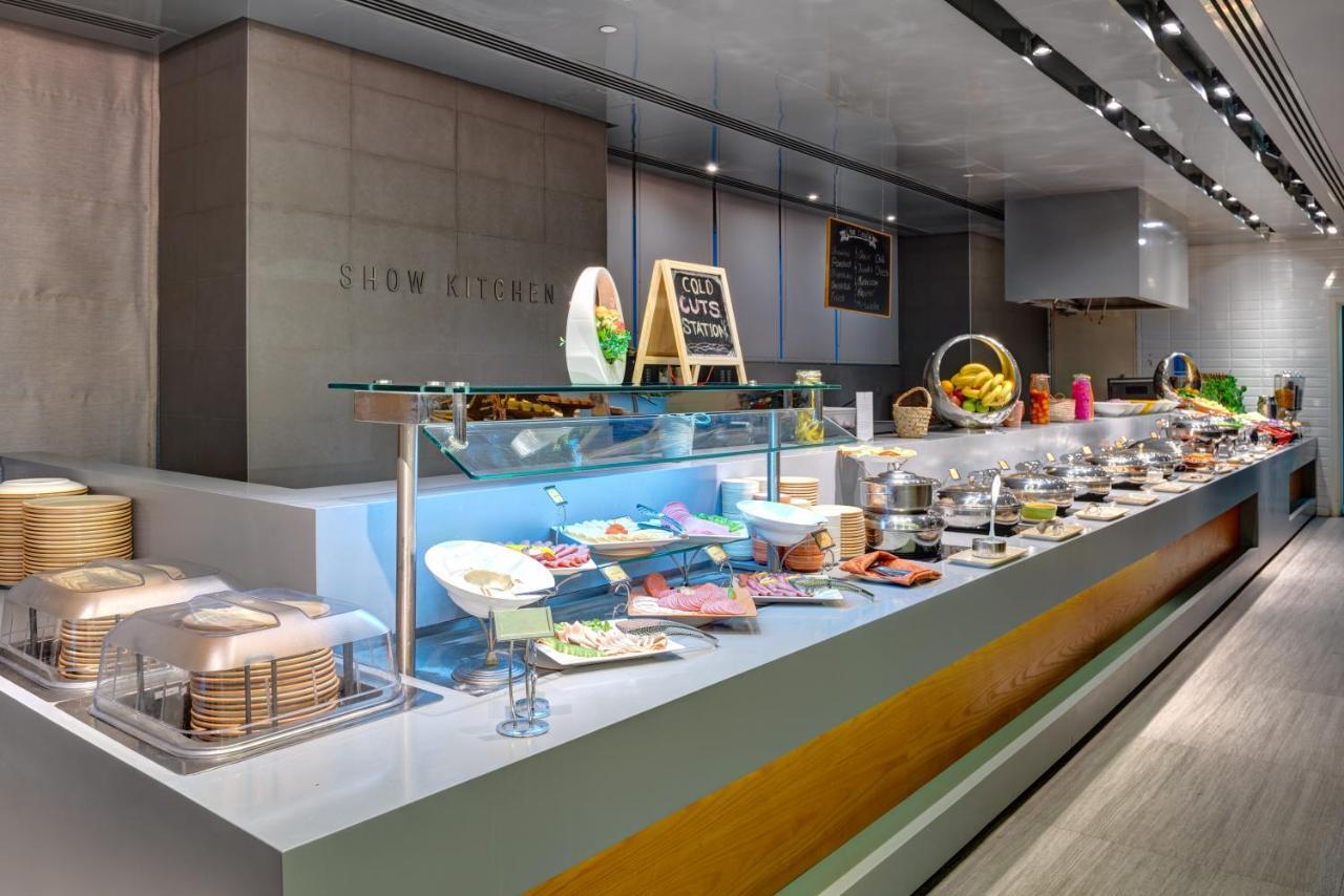 فندق إيه سي تي الشارقة المظهر الخارجي الصورة A buffet at a hotel